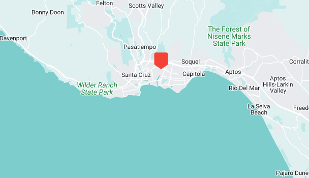 Map highlighting Santa Cruz, California, with surrounding areas like Bonny Doon, Scotts Valley, and Capitola. Nearby state parks such as Wilder Ranch and The Forest of Nisene Marks invite exploration. An ocean inspection reveals the stunning coastline to the south.