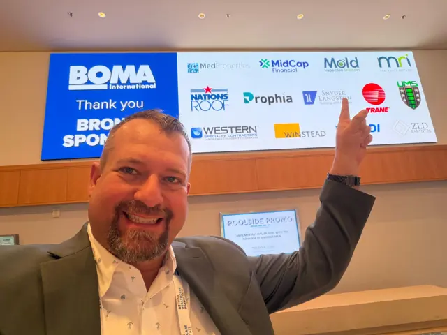 Celebrating Mold Inspection Sciences on the BOMA sponsor recognition display.