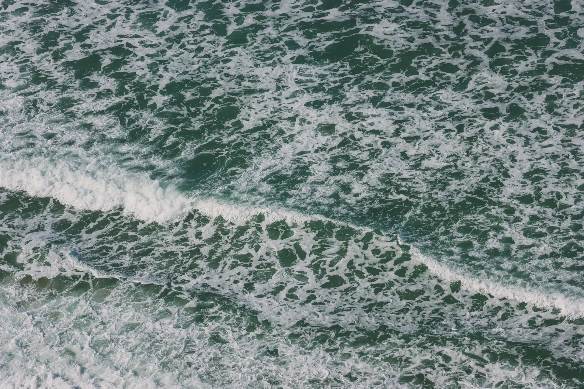 Foamy Pacific Ocean waves near San Diego, California. Photo by Ryan via Pexels; illustrative coastal image.