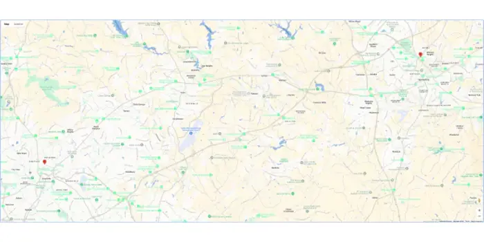A detailed map showing roads and locations in a region marked with green and red points, almost like a testing ground for travelers. Various towns and natural features like lakes are labeled. The map is oriented with north at the top, displaying a network of highways and routes.
