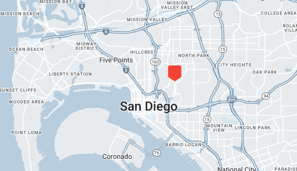 Map of San Diego highlighting a red area near the center for assessment. Major roads and neighborhoods, including Five Points, Hillcrest, and Coronado, are labeled, along with nearby ocean and bay areas.
